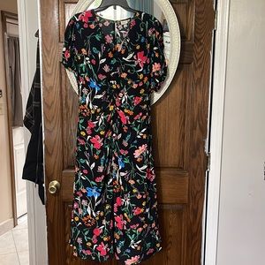 Beautiful spring dress has a ruched detail very slimming